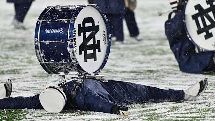 Nov 19, 2022; South Bend, Indiana, USA; Members of the Notre Dame Marching Band make snow angels following the game between the Notre Dame Fighting Irish and the Boston College Eagles at Notre Dame Stadium. Nov 19, 2022; South Bend, Indiana, USA; Members of the Notre Dame Marching Band make snow angels following the game between the Notre Dame Fighting Irish and the Boston College Eagles at Notre Dame Stadium.