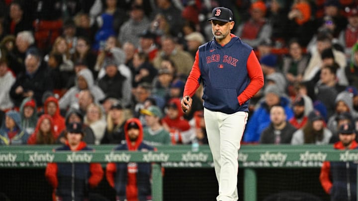 May 21, 2025; Boston, Massachusetts, USA; Boston Red Sox manager Alex Cora (13) walks to the mound during the sixth inning against the New York Mets at Fenway Park. Mandatory Credit: Eric Canha-Imagn Images
