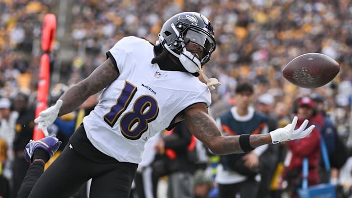 Nov 17, 2024; Pittsburgh, Pennsylvania, USA; Baltimore Ravens wide receiver Diontae Johnson (18) reaches for an incomplete pass against the Pittsburgh Steelers during the first quarter at Acrisure Stadium.