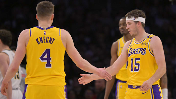  Los Angeles Lakers guard Dalton Knecht (4) and guard Austin Reaves (15) on the court in the first half against the Denver Nuggets at Crypto.com Arena.