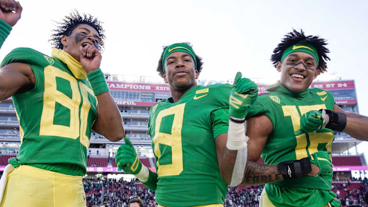 Dec 31, 2018; Santa Clara, CA, USA; Oregon Ducks wide receiver Bryan Addison (80) and safety Jevon Holland (8) and safety Nick Pickett (16) celebrate on the sidelines during the fourth quarter against the Michigan State Spartans at Levi's Stadium.
