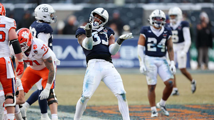 Penn State Nittany Lions defensive end Dani Dennis-Sutton (33) celebrates after a sack against the Clemson Tigers during the 2025 Pinstripe Bowl at Yankee Stadium.