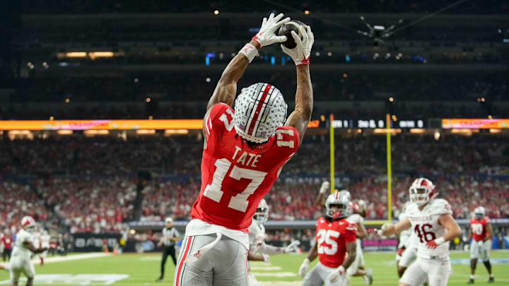 Ohio State Buckeyes wide receiver Carnell Tate (17) makes a catch for a touchdown Saturday, Dec. 6, 2025, during the Big Ten football championship against the Indiana Hoosiers at Lucas Oil Stadium in Indianapolis. Ohio State Buckeyes wide receiver Carnell Tate (17) makes a catch for a touchdown Saturday, Dec. 6, 2025, during the Big Ten football championship against the Indiana Hoosiers at Lucas Oil Stadium in Indianapolis.