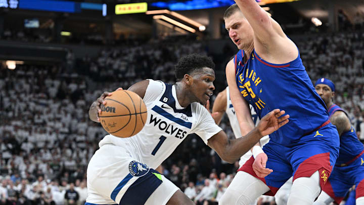 Apr 21, 2023; Minneapolis, Minnesota, USA; Minnesota Timberwolves guard Anthony Edwards (1) and Nuggets center Nikola Jokic (15)