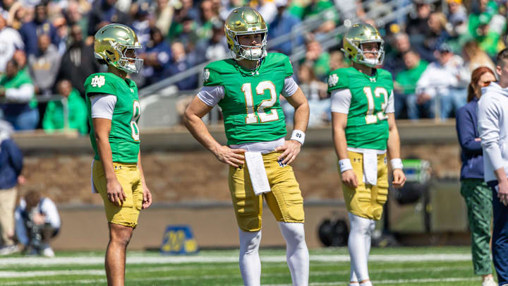 Apr 12, 2025; Notre Dame, IN, USA; Notre Dame Fighting Irish quarterback Kenny Minchey (8), Notre Dame Fighting Irish quarterback Blake Hebert (12), Notre Dame Fighting Irish quarterback CJ Carr (13) watch during the Blue-Gold game at Notre Dame Stadium. Mandatory Credit: Michael Caterina-Imagn Images
