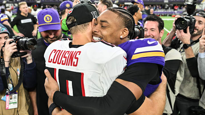 Dec 8, 2024; Minneapolis, Minnesota, USA; Atlanta Falcons quarterback Kirk Cousins (18) and Minnesota Vikings wide receiver Justin Jefferson (18) greet each other after the game at U.S. Bank Stadium.