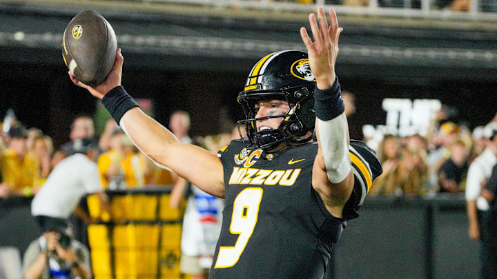 Aug 28, 2025; Columbia, Missouri, USA; Missouri Tigers quarterback Beau Pribula (9) celebrates after scoring a touchdown against the Central Arkansas Bears during the second half of the game at Faurot Field at Memorial Stadium. Mandatory Credit: Denny Medley-Imagn Images