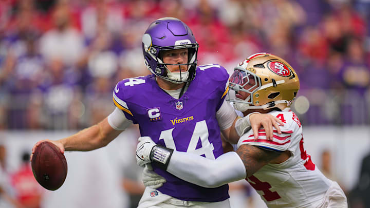Sep 15, 2024; Minneapolis, Minnesota, USA; San Francisco 49ers defensive end Yetur Gross-Matos (94) tackles Minnesota Vikings quarterback Sam Darnold (14) in the third quarter at U.S. Bank Stadium. Mandatory Credit: Brad Rempel-Imagn Images