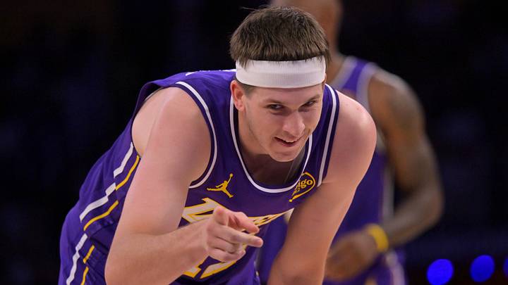 Feb 5, 2026; Los Angeles, California, USA;  Los Angeles Lakers guard Austin Reaves (15) reacts after a foul in the second half against the Philadelphia 76ers at Crypto.com Arena. Mandatory Credit: Jayne Kamin-Oncea-Imagn Images