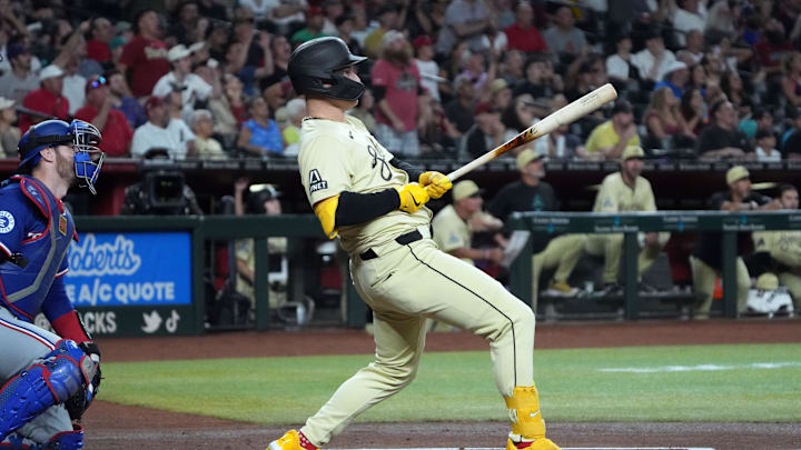 Arizona Diamondbacks designated hitter Joc Pederson (3) hits a solo home run against the Texas Rangers in the first inning at Chase Field. 