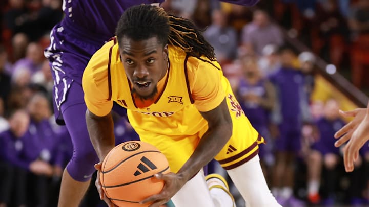 Jan 10, 2026; Tempe, Arizona, USA; Arizona State Sun Devils guard Anthony Johnson (2) drives to the basket against Kansas State Wildcats guard Abdi Bashir Jr. (1) in the second half at Desert Financial Arena. Mandatory Credit: Mark J. Rebilas-Imagn Images