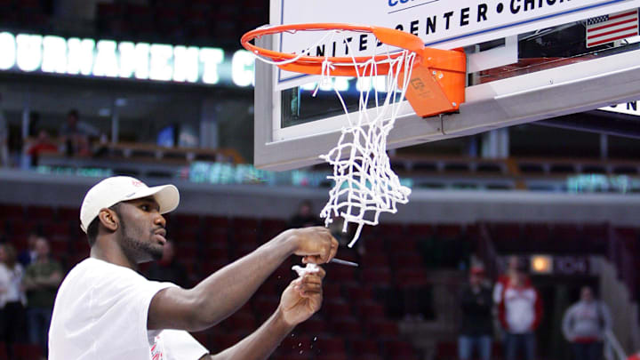 Mar 11, 2007; Chicago, IL, USA; Ohio State Buckeyes center (20) Greg Oden cuts off a piece of the net after winning the championship game of the Big Ten Tournament at the United Center in Chicago, IL. Ohio State defeated Wisconsin 66-49. Mandatory Credit: Jerry Lai-Imagn Images Copyright © 2007 Jerry Lai Mar 11, 2007; Chicago, IL, USA; Ohio State Buckeyes center (20) Greg Oden cuts off a piece of the net after winning the championship game of the Big Ten Tournament at the United Center in Chicago, IL. Ohio State defeated Wisconsin 66-49. Mandatory Credit: Jerry Lai-Imagn Images Copyright © 2007 Jerry Lai
