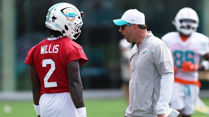 Miami Dolphins quarterback Malik Willis (2) talks with passing game coordinator Kevin Patullo during minicamp at the Baptist Health Training Complex.