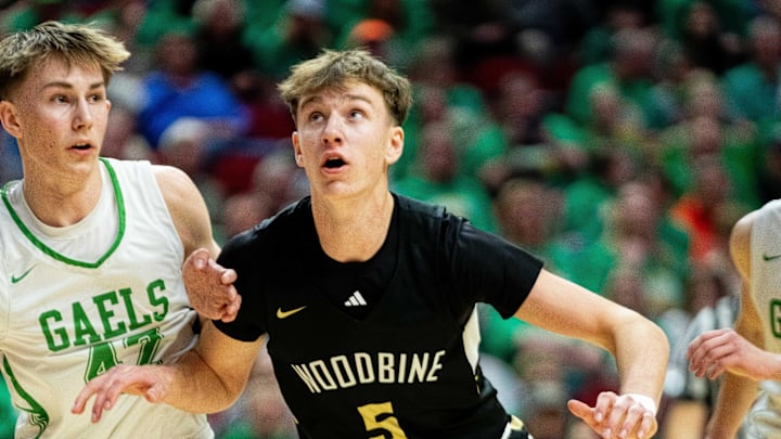 Woodbine's Landon Blum and Carson Bargfrede of St. Edmond battle during the IHSAA Class 1A state quarterfinal on Wednesday, March 12, 2025, at Wells Fargo Arena. Woodbine's Landon Blum and Carson Bargfrede of St. Edmond battle during the IHSAA Class 1A state quarterfinal on Wednesday, March 12, 2025, at Wells Fargo Arena.