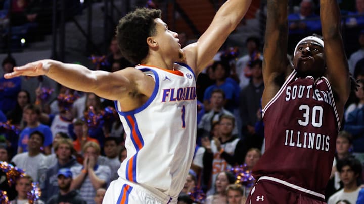 Kennard Davis Jr. goes up against Florida's Walter Clayton Jr. earlier this year for Southern Illinois. Davis has entered the transfer portal and is a key target for Iowa State.