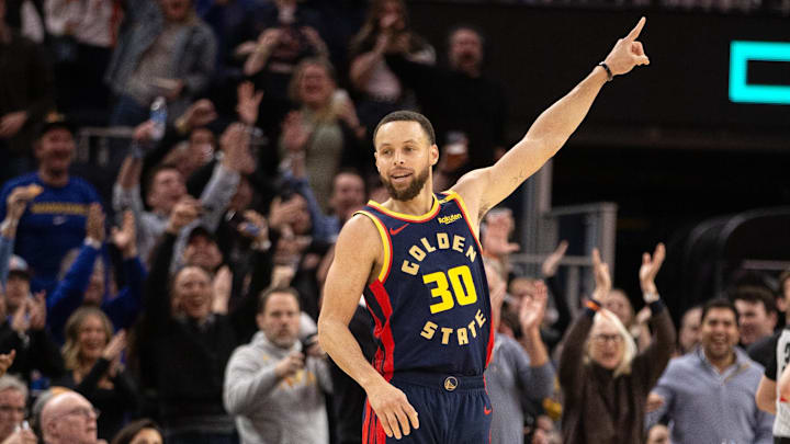 Mar 13, 2025; San Francisco, California, USA; Golden State Warriors guard Stephen Curry (30) celebrates his 4,000th career 3-point basket during the third quarter against the Sacramento Kings at Chase Center. Mandatory Credit: D. Ross Cameron-Imagn Images