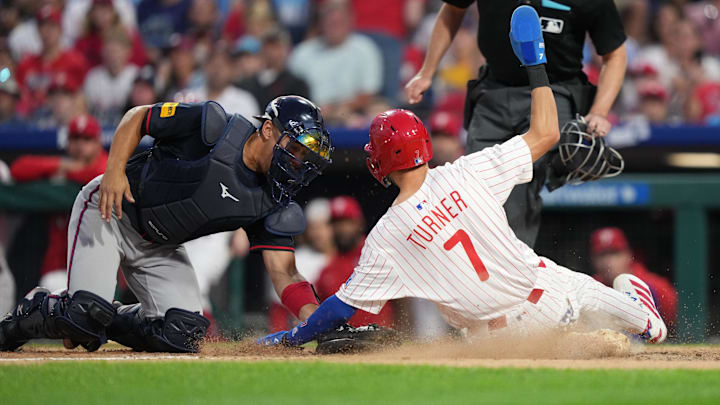 Aug 30, 2025; Philadelphia, Pennsylvania, USA; Atlanta Braves catcher Drake Baldwin (30) tags out Philadelphia Phillies infielder Trea Turner (7) in the sixth inning at Citizens Bank Park.