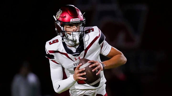 Oscar Rios of Downey High scrambles against Red Mountain (AZ).