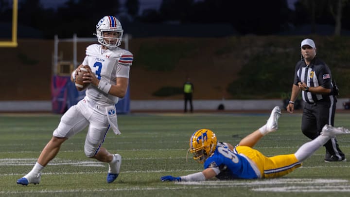 Ryder Lyons scrambles away from a Grant defender during a 51-13 victory to Open the 2025 season. Lyons signed a NIL deal with Under Armour it was announced Thursday morning