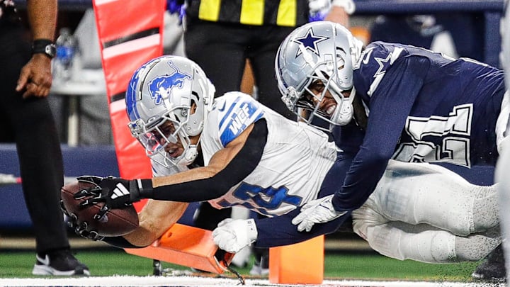 Detroit Lions wide receiver Amon-Ra St. Brown scores a touchdown against Dallas Cowboys cornerback Stephon Gilmore 