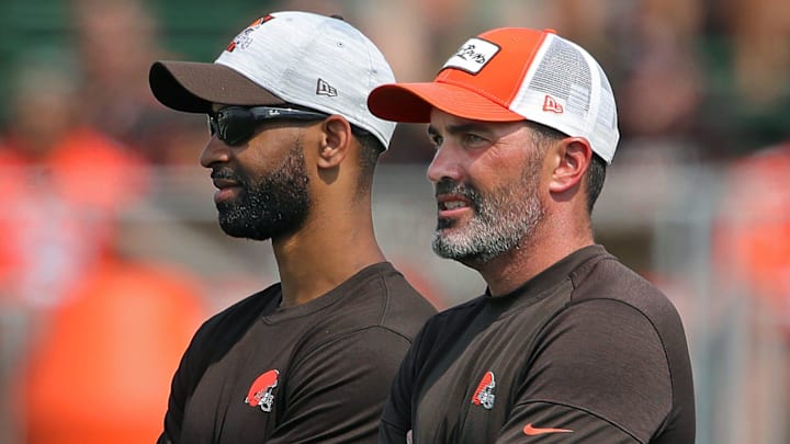Browns GM Andrew Berry, left, and coach Kevin Stefanski watch practice in training camp, Saturday, July 31, 2021, in Berea.