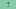 Green alien toy figure on a plain green background