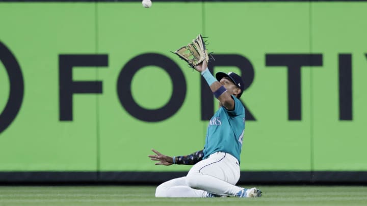 Seattle Mariners center fielder Julio Rodriguez (44) catches a fly ball hit by Houston Astros shortstop Jeremy Pena (not pictured) during the ninth inning at T-Mobile Park on July 20. Seattle Mariners center fielder Julio Rodriguez (44) catches a fly ball hit by Houston Astros shortstop Jeremy Pena (not pictured) during the ninth inning at T-Mobile Park on July 20.
