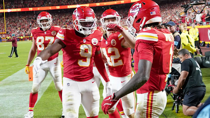 Oct 7, 2024; Kansas City, Missouri, USA; Kansas City Chiefs wide receiver Xavier Worthy (1) celebrates with wide receiver JuJu Smith-Schuster (9) and running back Carson Steele (42) after scoring a touchdown against the New Orleans Saints during the second half at GEHA Field at Arrowhead Stadium. Mandatory Credit: Denny Medley-Imagn Images