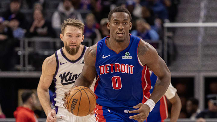 Jan 25, 2026; Detroit, Michigan, USA; Detroit Pistons center Jalen Duren (0) moves the ball up court in front of Sacramento Kings forward Domantas Sabonis (11) during the during the second half at Little Caesars Arena. Mandatory Credit: David Reginek-Imagn Images