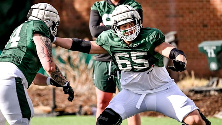 Michigan State offensive lineman Stanton Ramil, right, and Gavin Broscious work out during football practice on Tuesday, April 8, 2025, in East Lansing.