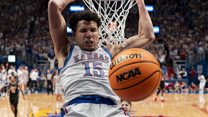 Feb 3, 2024; Lawrence, Kansas, USA; Kansas Jayhawks guard Kevin McCullar Jr. (15) dunks the ball during the first half against the Houston Cougars at Allen Fieldhouse. Mandatory Credit: Jay Biggerstaff-USA TODAY Sports Feb 3, 2024; Lawrence, Kansas, USA; Kansas Jayhawks guard Kevin McCullar Jr. (15) dunks the ball during the first half against the Houston Cougars at Allen Fieldhouse. Mandatory Credit: Jay Biggerstaff-USA TODAY Sports