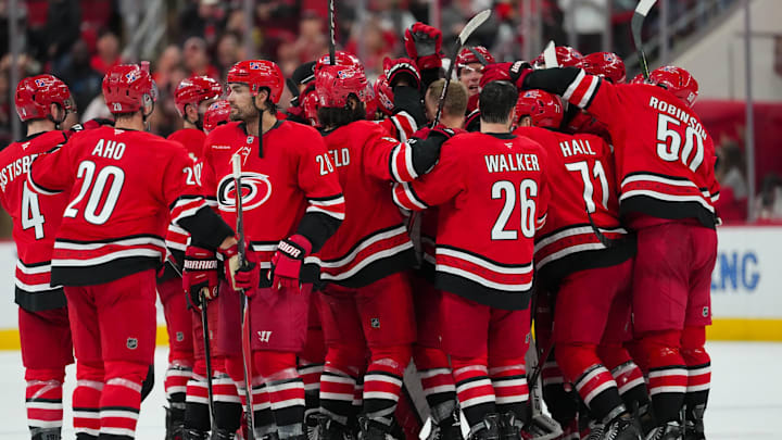 Nov 30, 2025; Raleigh, North Carolina, USA; Carolina Hurricanes players celebrate their victory against the Calgary Flames in the over time at Lenovo Center. Mandatory Credit: James Guillory-Imagn Images Nov 30, 2025; Raleigh, North Carolina, USA; Carolina Hurricanes players celebrate their victory against the Calgary Flames in the over time at Lenovo Center. Mandatory Credit: James Guillory-Imagn Images
