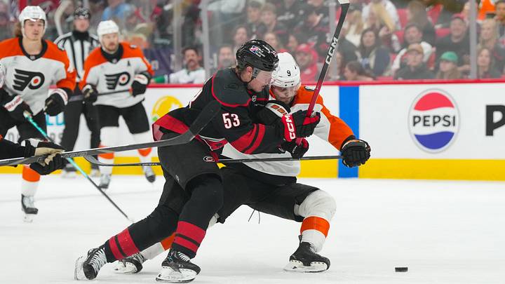 May 2, 2026; Raleigh, North Carolina, USA; aCarolina Hurricanes right wing Jackson Blake (53) and Philadelphia Flyers defenseman Jamie Drysdale (9) battle over the puck during the third period t Lenovo Center. Mandatory Credit: James Guillory-Imagn Images