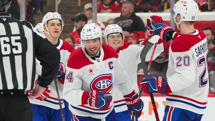 Mar 29, 2026; Raleigh, North Carolina, USA; Montreal Canadiens center Nick Suzuki (14) celebrates his goal with left wing Juraj Slafkovsky (20), right wing Cole Caufield (13) and right wing Ivan Demidov (93) against the Carolina Hurricanes during the third period at Lenovo Center. Mandatory Credit: James Guillory-Imagn Images Mar 29, 2026; Raleigh, North Carolina, USA; Montreal Canadiens center Nick Suzuki (14) celebrates his goal with left wing Juraj Slafkovsky (20), right wing Cole Caufield (13) and right wing Ivan Demidov (93) against the Carolina Hurricanes during the third period at Lenovo Center. Mandatory Credit: James Guillory-Imagn Images
