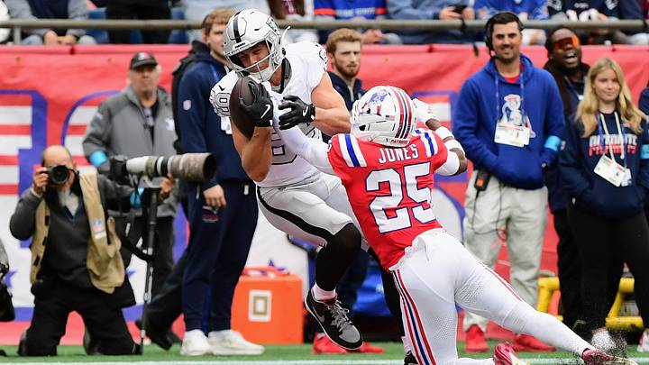 Oct 11, 2026; Foxborough, Massachusetts, USA;  Las Vegas Raiders tight end Brock Bowers (89) catches a thirteen-yard touchdown pass from quarterback Kirk Cousins (not pictured) against New England Patriots cornerback Marcus Jones (25) during the first quarter at Gillette Stadium.  Mandatory Credit: Bob DeChiara-Imagn Images