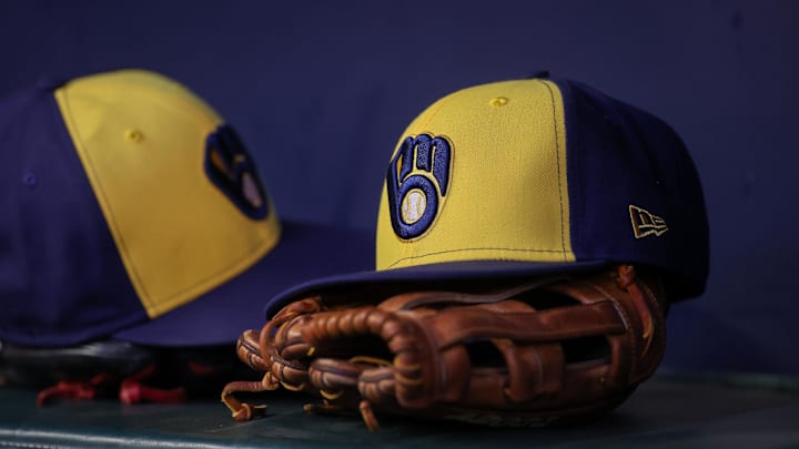 Jul 28, 2023; Atlanta, Georgia, USA; A detailed view of a Milwaukee Brewers hat and glove on the bench against the Atlanta Braves in the second inning at Truist Park. Mandatory Credit: Brett Davis-Imagn Images Jul 28, 2023; Atlanta, Georgia, USA; A detailed view of a Milwaukee Brewers hat and glove on the bench against the Atlanta Braves in the second inning at Truist Park. Mandatory Credit: Brett Davis-Imagn Images
