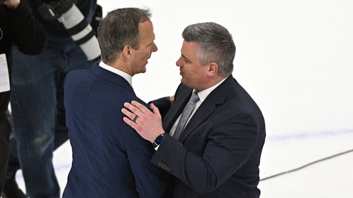 Tampa Bay Lightning head coach Jon Cooper (left) shakes hands with Sheldon Keefe. Mandatory Credit: Dan Hamilton-Imagn Images
