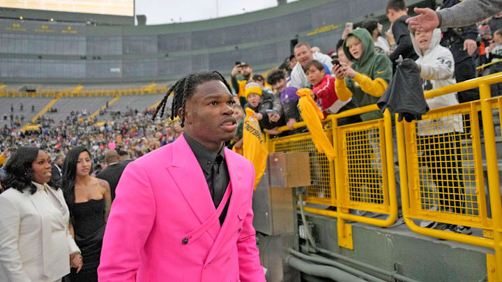 NFL draft prospect, Colorado Buffaloes wide receiver Travis Hunter, signs autographs during the NFL Draft Red Carpet event at Lambeau Field in Green Bay on Thursday, April 24, 2025. NFL draft prospect, Colorado Buffaloes wide receiver Travis Hunter, signs autographs during the NFL Draft Red Carpet event at Lambeau Field in Green Bay on Thursday, April 24, 2025.