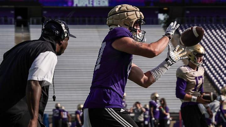 Ryan Otton catches a pass in 2023 with former receivers coach JaMarcus Shephard right on his shoulder. 