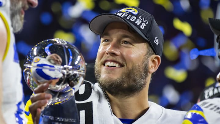 Feb 13, 2022; Inglewood, CA, USA; Los Angeles Rams quarterback Matthew Stafford celebrates with the Lombardi Trophy after defeating the Cincinnati Bengals in Super Bowl LVI at SoFi Stadium. Mandatory Credit: Mark J. Rebilas-Imagn Images