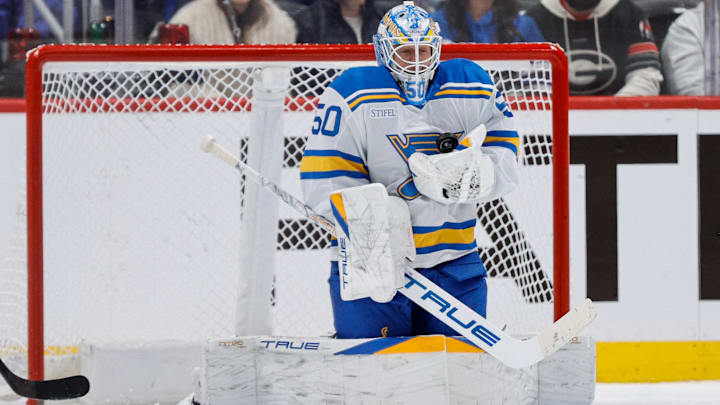 Dec 31, 2025; Denver, Colorado, USA; St. Louis Blues goaltender Jordan Binnington (50) makes a save on a shot in the first period against the Colorado Avalanche at Ball Arena. Mandatory Credit: Isaiah J. Downing-Imagn Images
