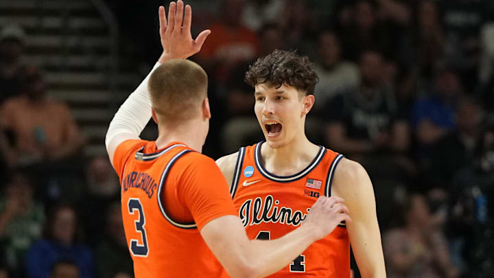 Mar 21, 2026; Greenville, SC, USA; Illinois Fighting Illini center Zvonimir Ivisic (44) reacts with forward Ben Humrichous (3) in the first half during a second round game of the men's 2026 NCAA Tournament at Bon Secours Wellness Arena. Mandatory Credit: Bob Donnan-Imagn Images