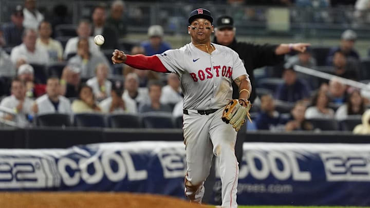 Sep 12, 2024; Bronx, New York, USA; Boston Red Sox third baseman Rafael Devers (11) throws out New York Yankees shortstop Anthony Volpe (not pictured) after fielding a ground ball during the ninth inning at Yankee Stadium. Mandatory Credit: Gregory Fisher-Imagn Images