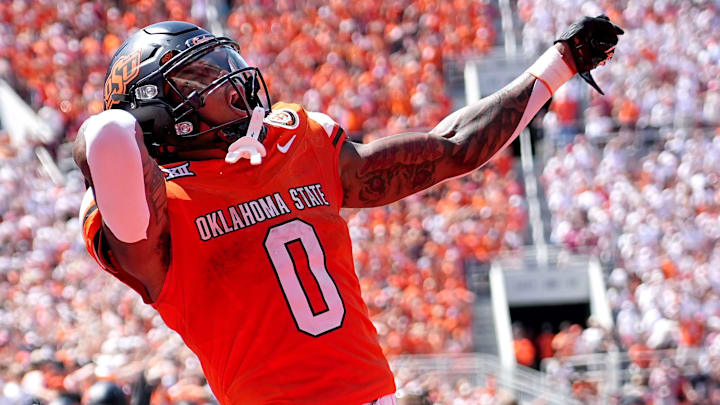 Oklahoma State's Ollie Gordon II (0) celebrates in the second half of the college football game between the Oklahoma State Cowboys and the Arkansas Razorbacks at Boone Pickens Stadium in Stillwater, Okla.,, Saturday, Sept., 7, 2024.
