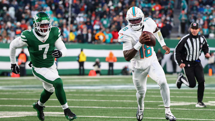 Miami Dolphins quarterback Tyler Huntley (18) runs with the ball while being pursued by New York Jets defensive end Haason Reddick (7) during the second quarter at MetLife Stadium. Miami Dolphins quarterback Tyler Huntley (18) runs with the ball while being pursued by New York Jets defensive end Haason Reddick (7) during the second quarter at MetLife Stadium.