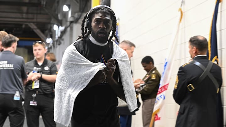 Dallas Cowboys cornerback Trevon Diggs walks out to see the field during a weather delay before the game against the Pittsburgh Steelers.