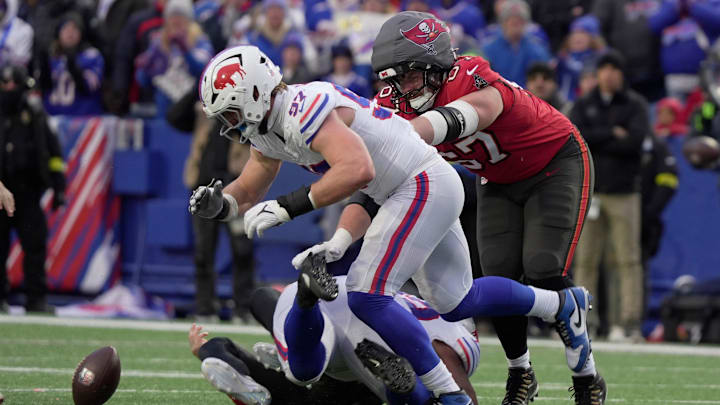 Buffalo Bills defensive end Joey Bosa tuns towards the fumble that Buffalo Bills defensive tackle DaQuan Jones caused after sacking Tampa Bay Buccaneers quarterback Baker Mayfield during second half action against the Tampa Bay Buccaneers on Nov 16, 2025 at Highmark Stadium in Orchard Park. The Bills recovered theh fumble.
