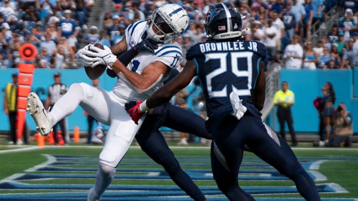 Indianapolis Colts wide receiver Michael Pittman Jr. (11) pulls down a touchdown pass while guarded by Tennessee Titans cornerback L'Jarius Sneed (38) and ornerback Jarvis Brownlee Jr. (29) during the fourth quarter of their game at Nissan Stadium in Nashville, Tenn., Sunday, Oct. 13, 2024. The score proved the be the winning touchdown with a final of Indianapolis 20 and Tennessee 17.