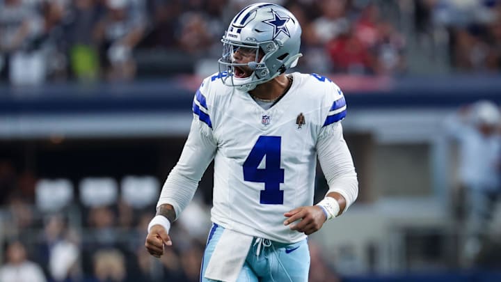 Dallas Cowboys quarterback Dak Prescott reacts after throwing a touchdown pass during against the Patriots.