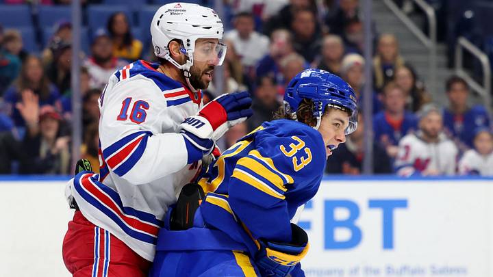 Dec 11, 2024; Buffalo, New York, USA; New York Rangers center Vincent Trocheck (16) and Buffalo Sabres defenseman Ryan Johnson (33) battle for position in front of the net during the first period at KeyBank Center. Dec 11, 2024; Buffalo, New York, USA; New York Rangers center Vincent Trocheck (16) and Buffalo Sabres defenseman Ryan Johnson (33) battle for position in front of the net during the first period at KeyBank Center.